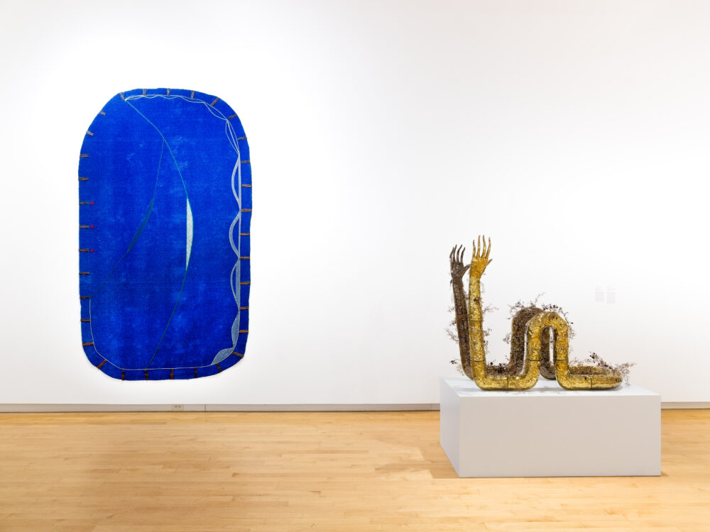 Installation view displaying multiple sculptures in an art gallery