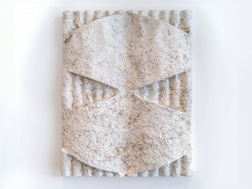 A white stucco relief