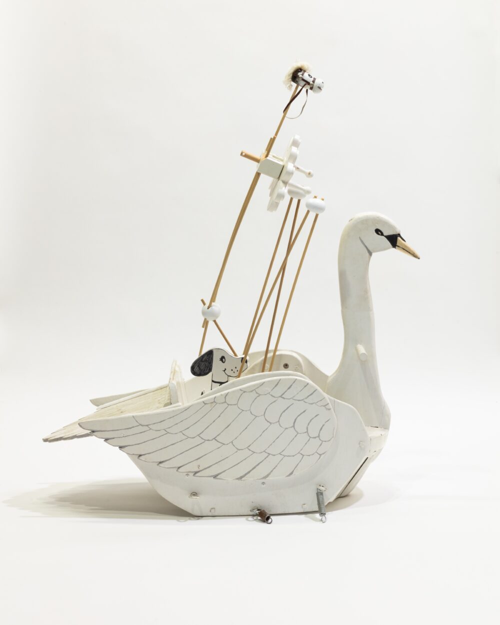 Figurative sculpture in a base of a wooden swan.