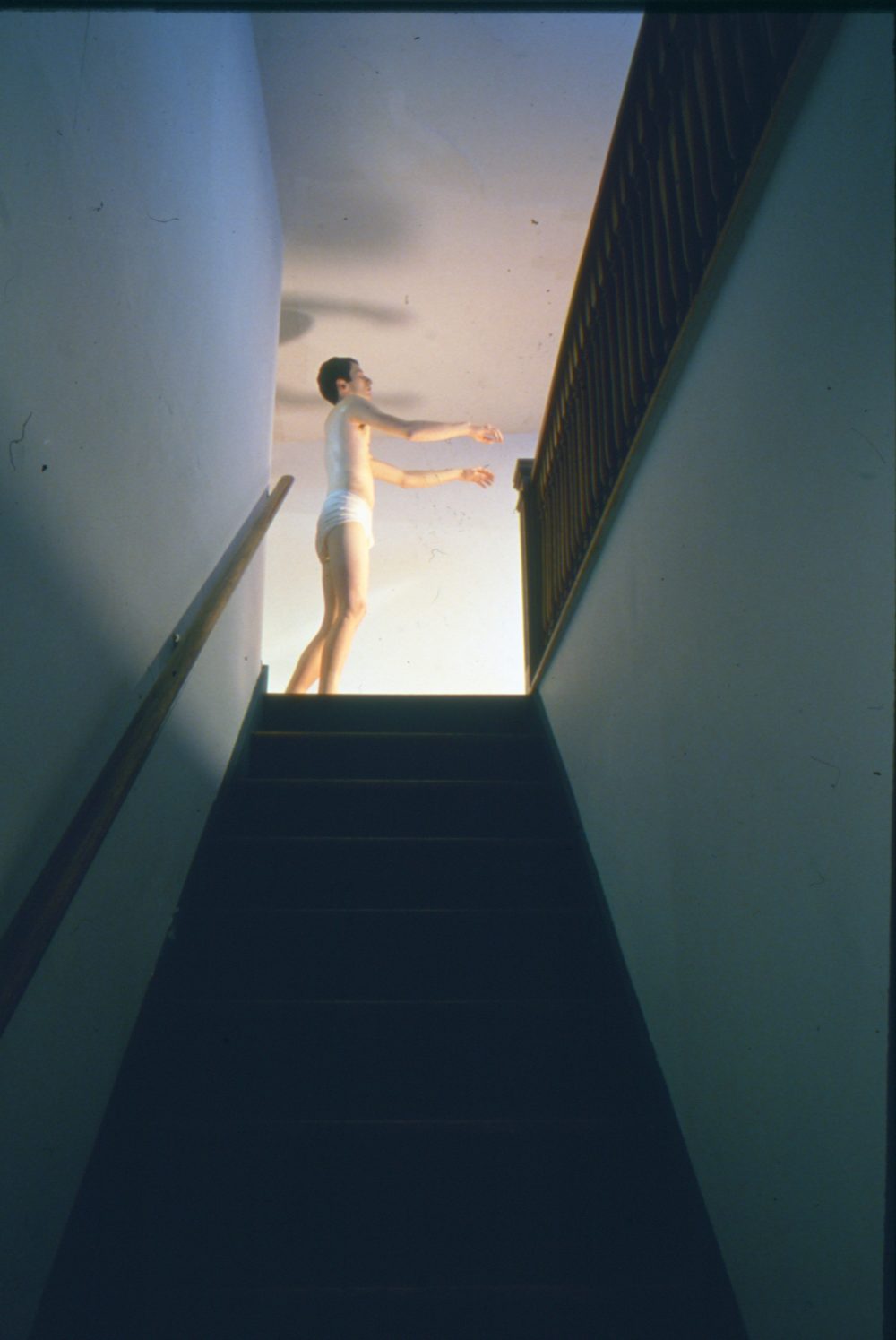 This is a photograph from an installation in the Pop Surrealism exhibitions which features a life like sculpture of a man sleep walking in his underwear