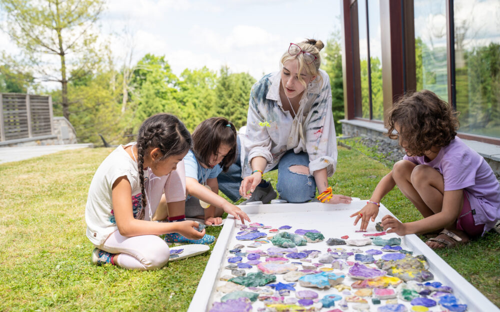 Children making art with their teacher