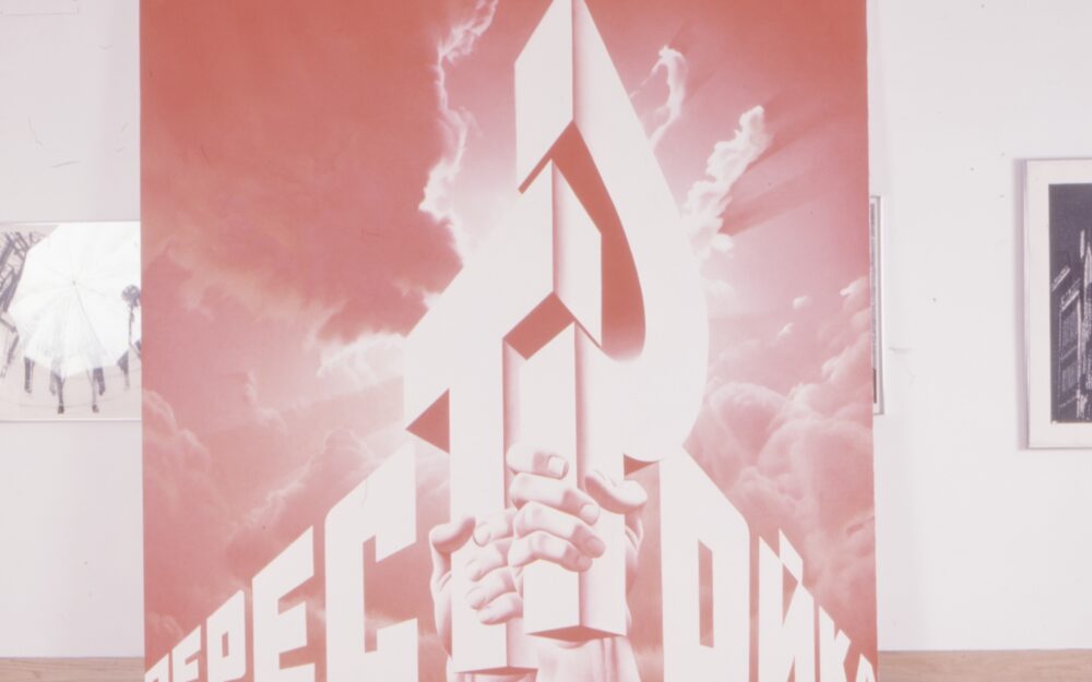 Installation image of red and white painting with Russian word creating hammer and sickle motif.