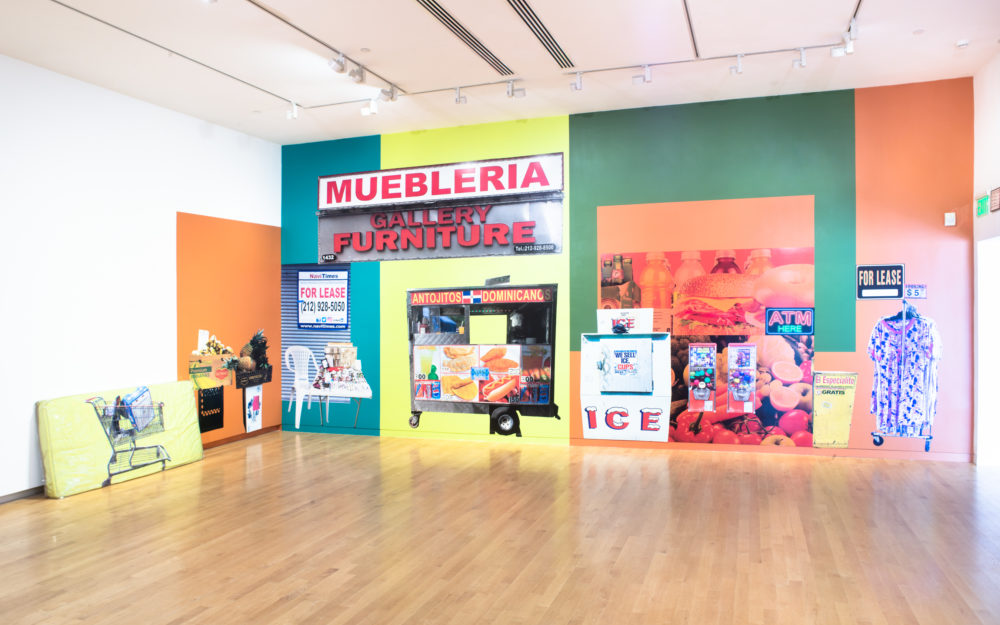 Large colorful mural covering entire gallery wall