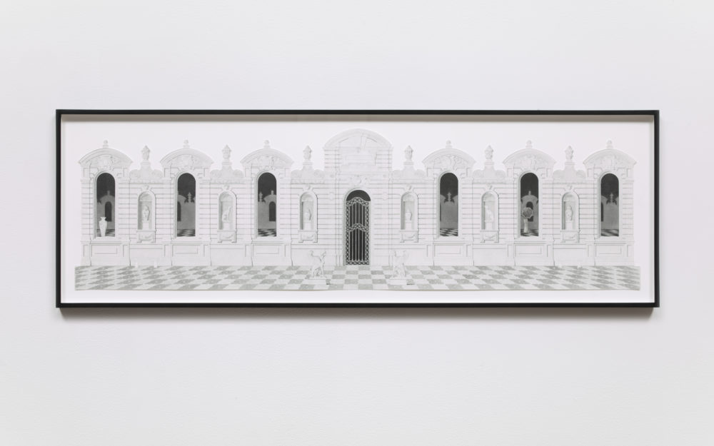 Building with a colonnade in grayscale with a women holding an umbrella.