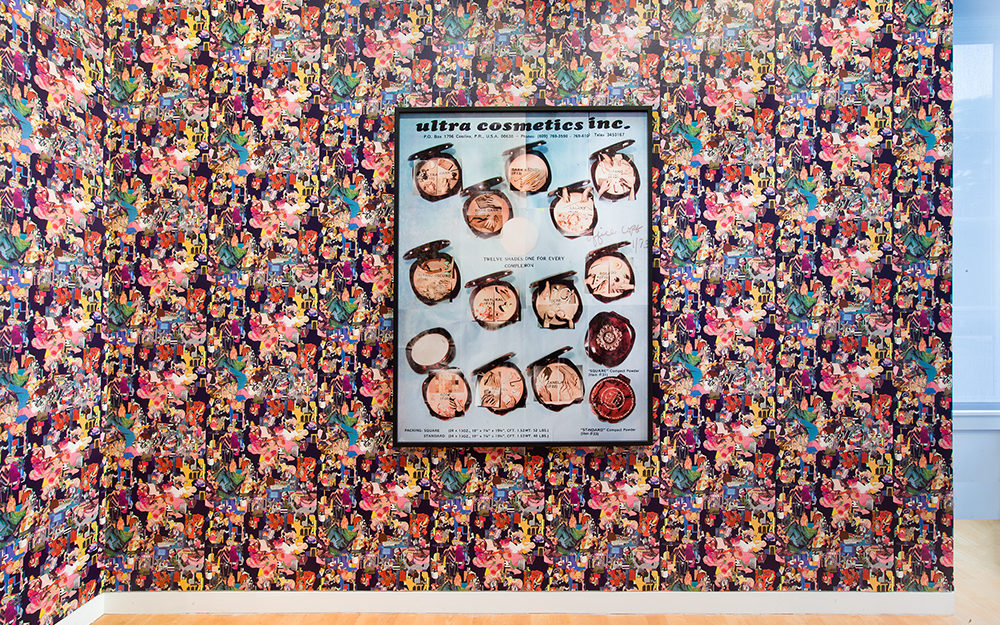 Image of multiple compact makeup powders in black frame on colorful wallpaper