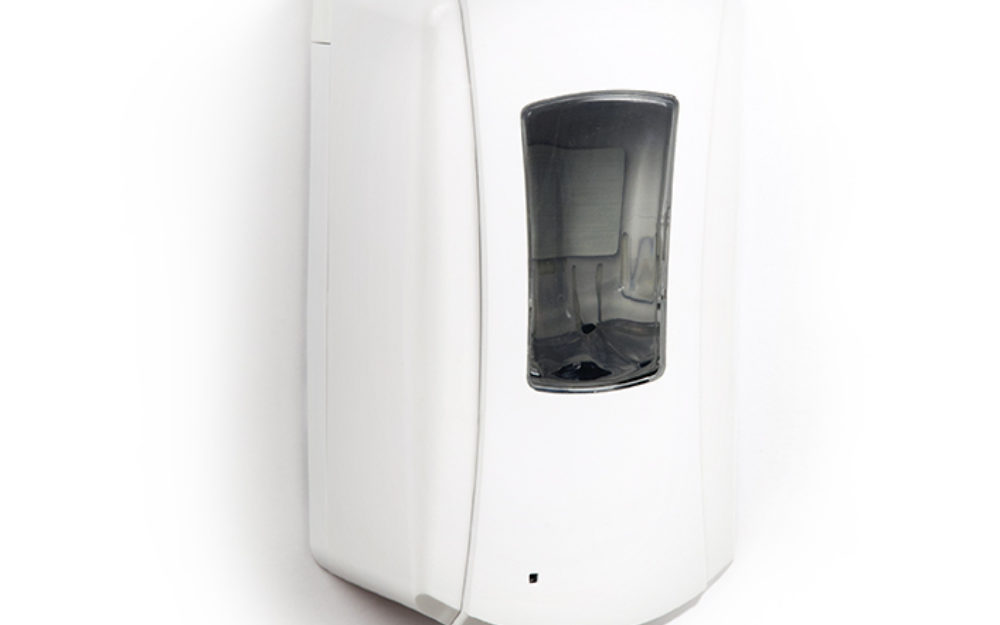 Hand sanitizer dispenser on white wall