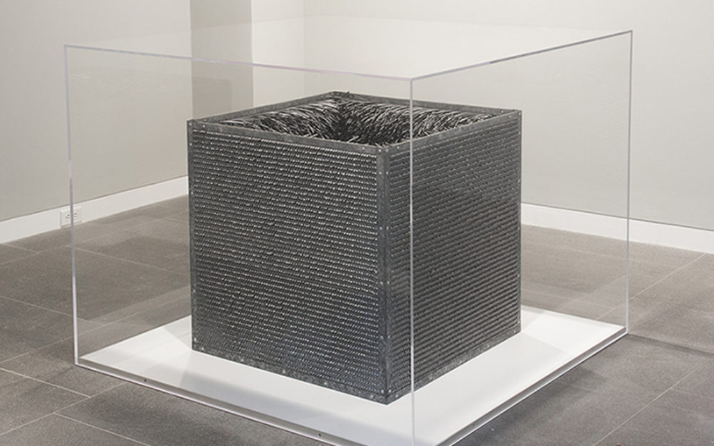 Silver box in a glass case