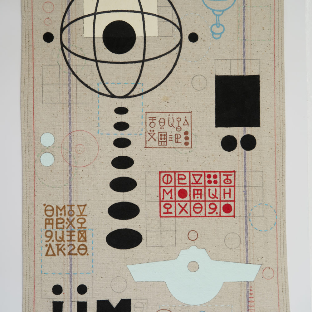 Abstract forms on a vertical tapestry.