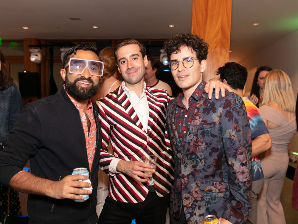 Three men at a party.