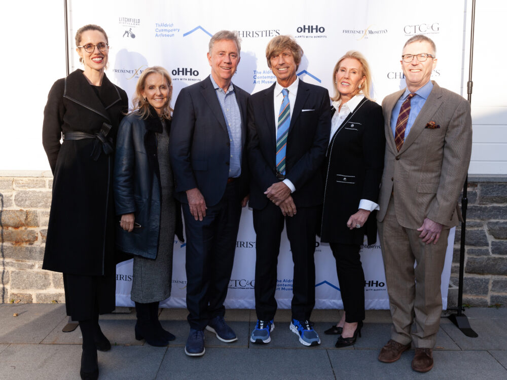 Guests in front of the step and repeat outside the Museum.