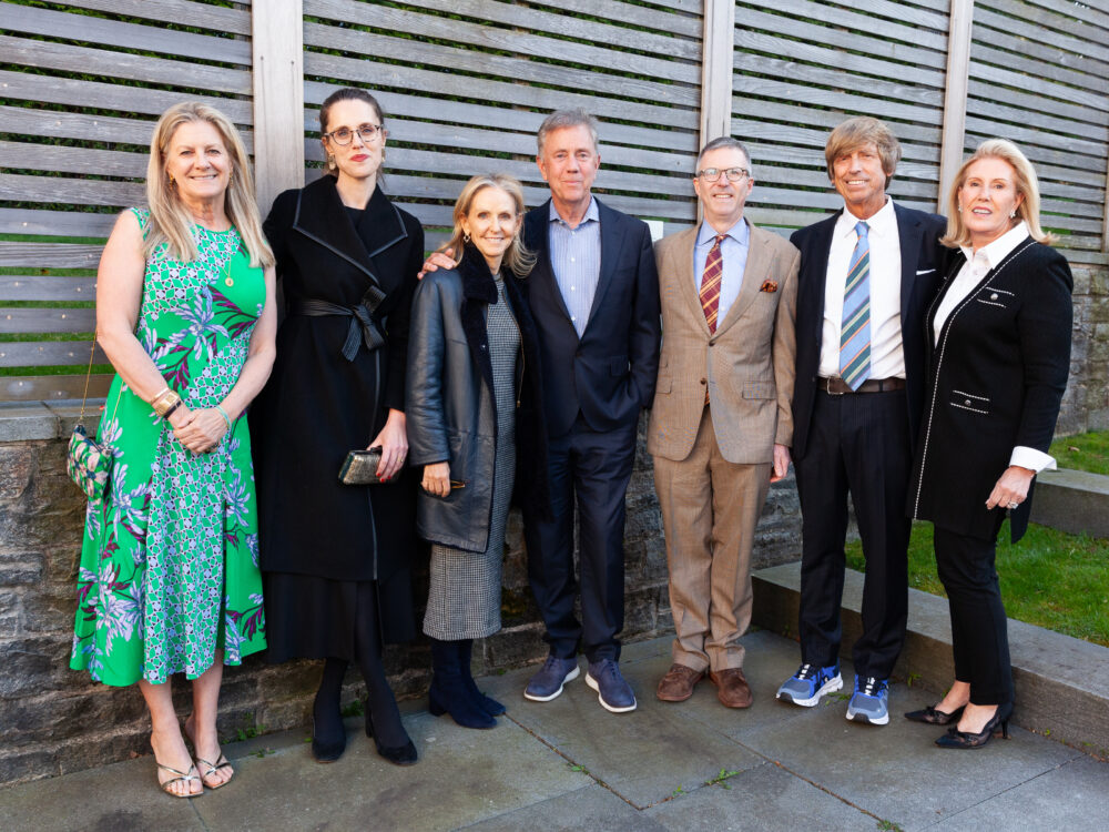 Guests in front of a fence outside the Museum.