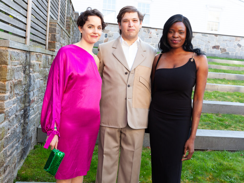 Three guests outside of the Museum.