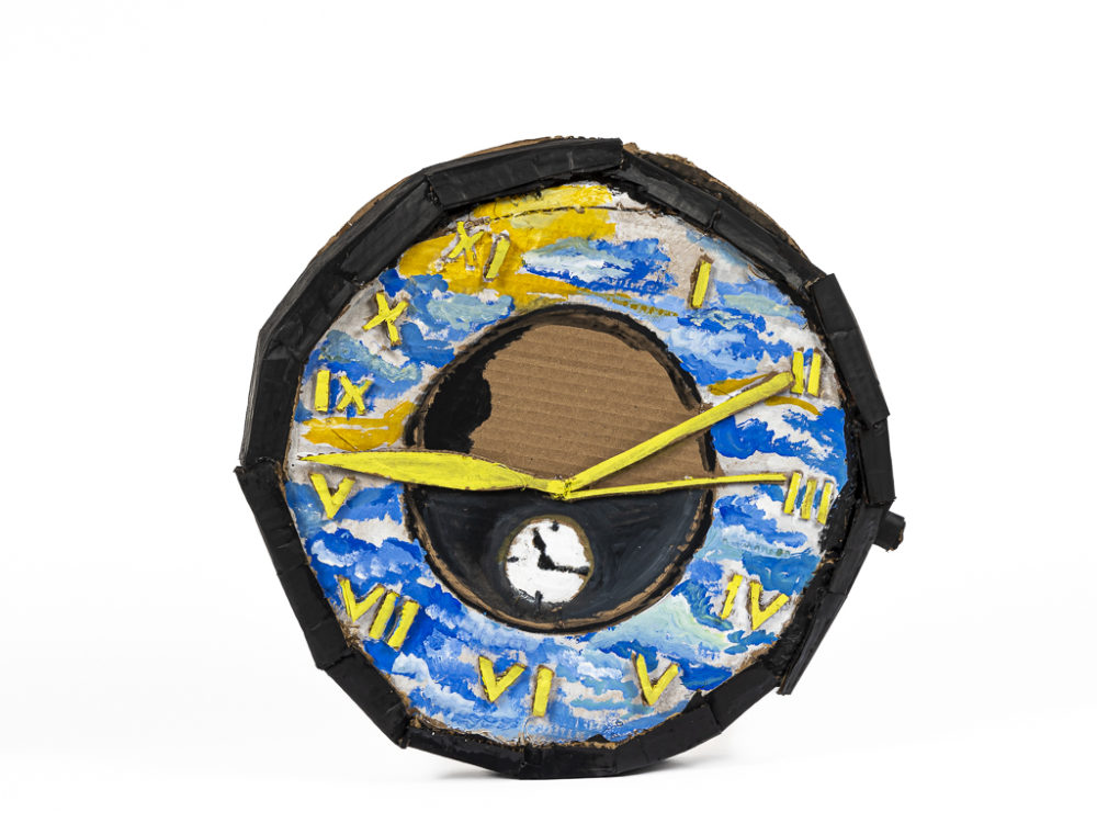 Sculpture of a watch dial with a sunrise.