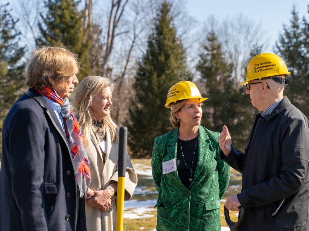A group of people chatting outside.
