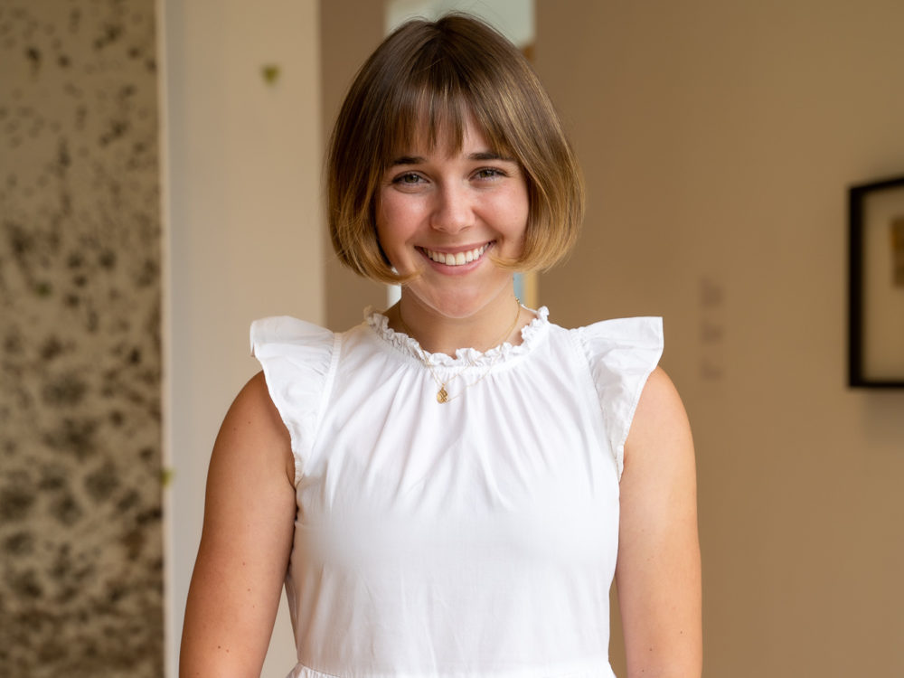 a photo of a woman in a gallery
