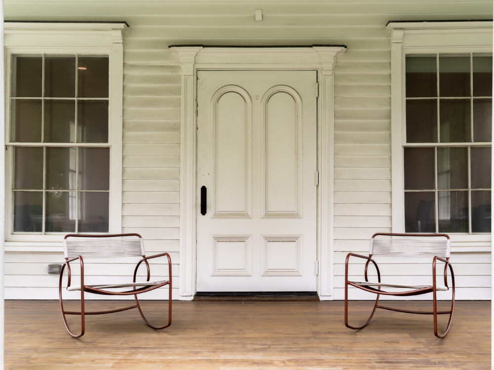 Two rocking chairs on a front porch