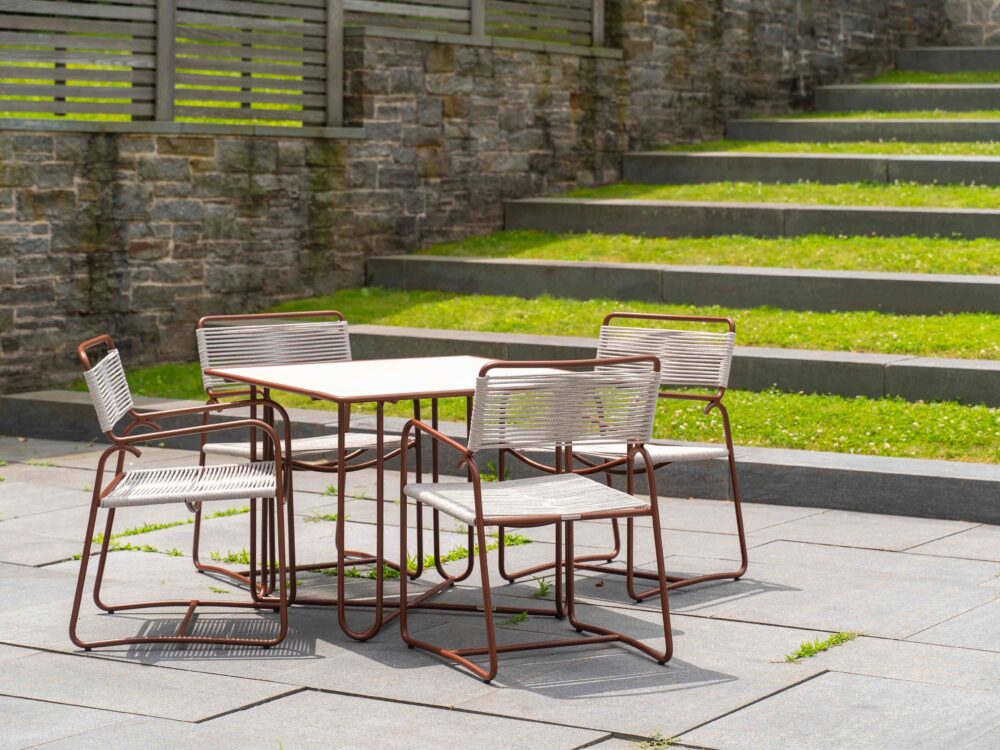 an outdoor table and chairs