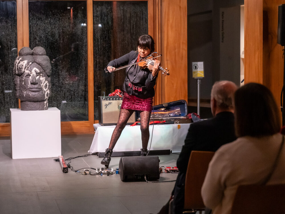 Laura Ortman playing a violin
