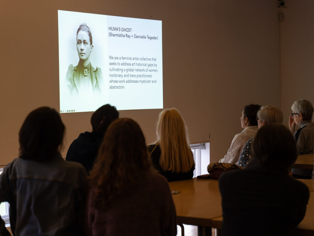 A class looking at a powerpoint slide