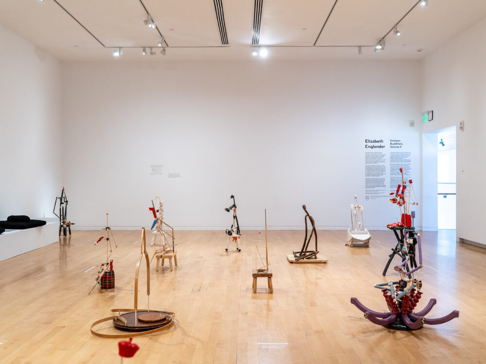 Side view of sculptures sited on a gallery floor.