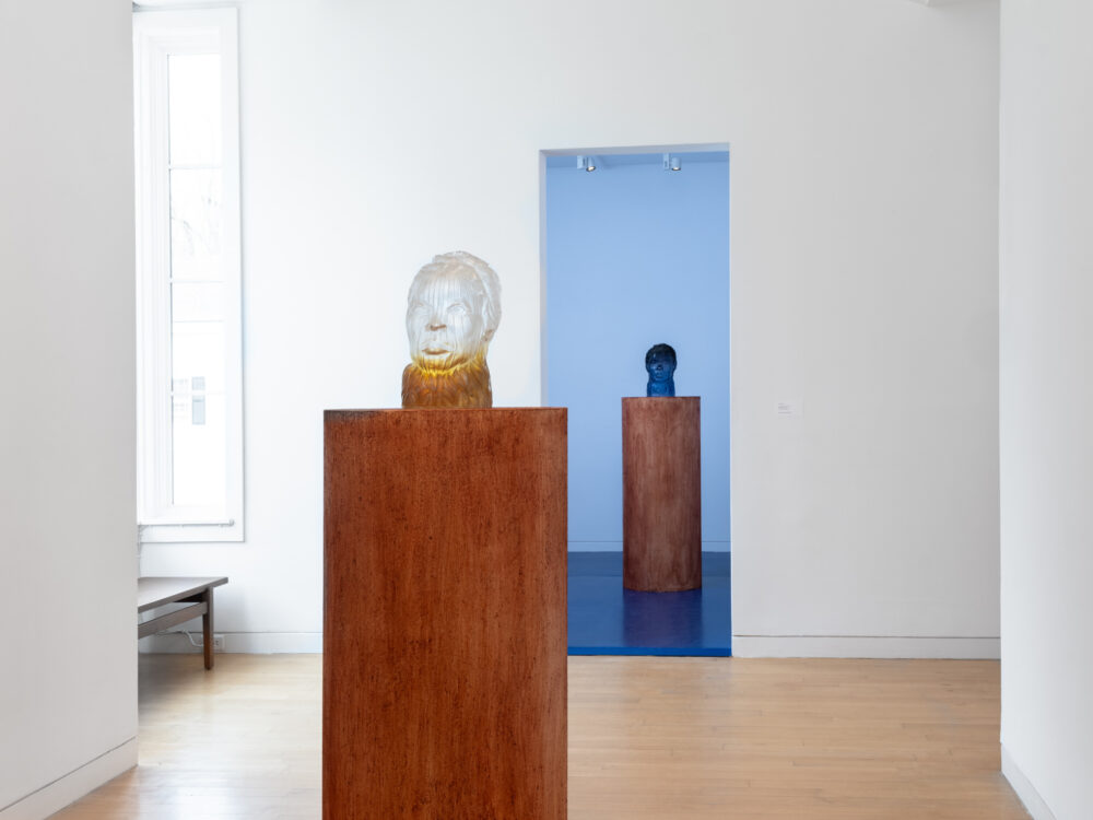 Glass sculptures on pedestals.