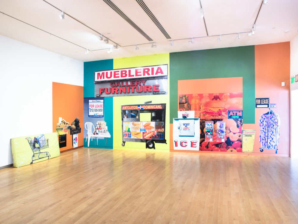 Large colorful mural covering entire gallery wall