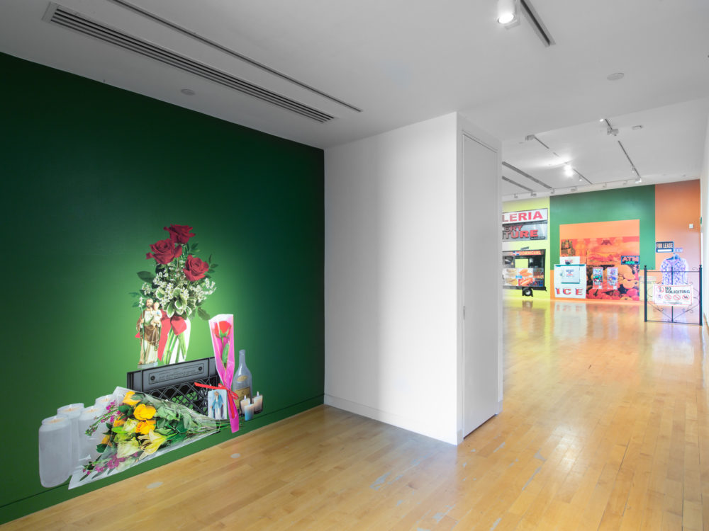 Vinyl installation of a memorial on a green wall