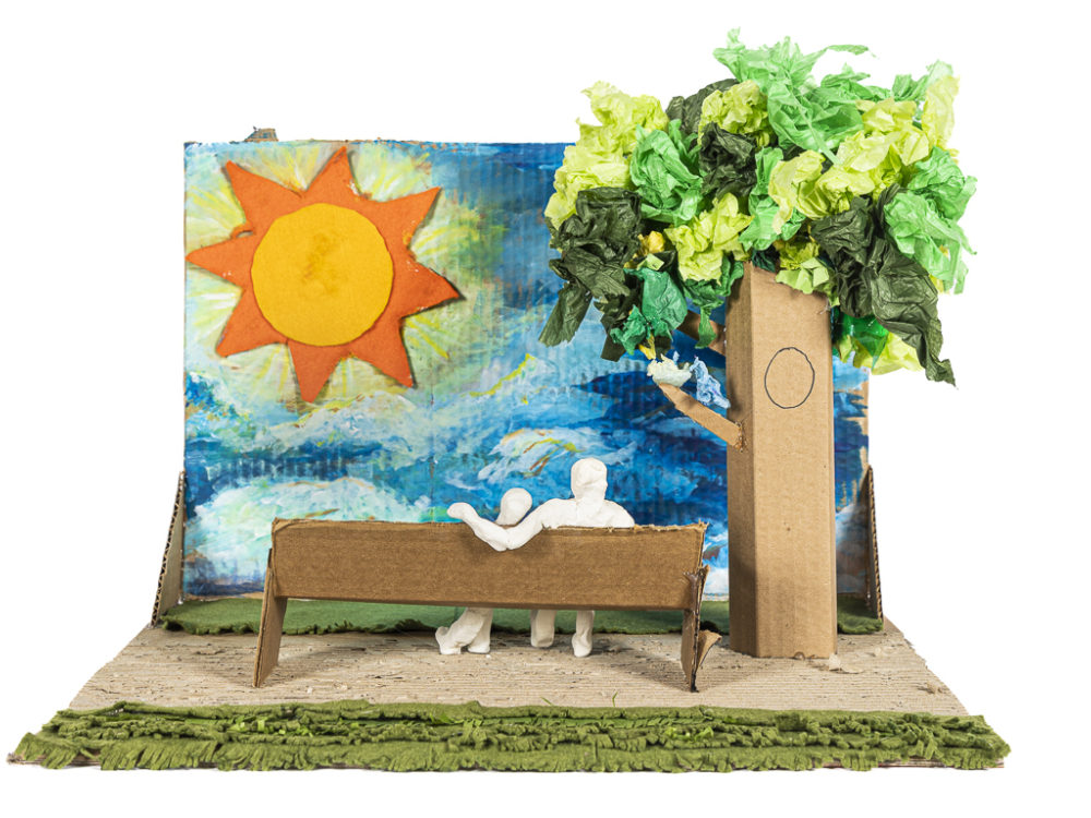 Sculpture of two figures seated on a bench