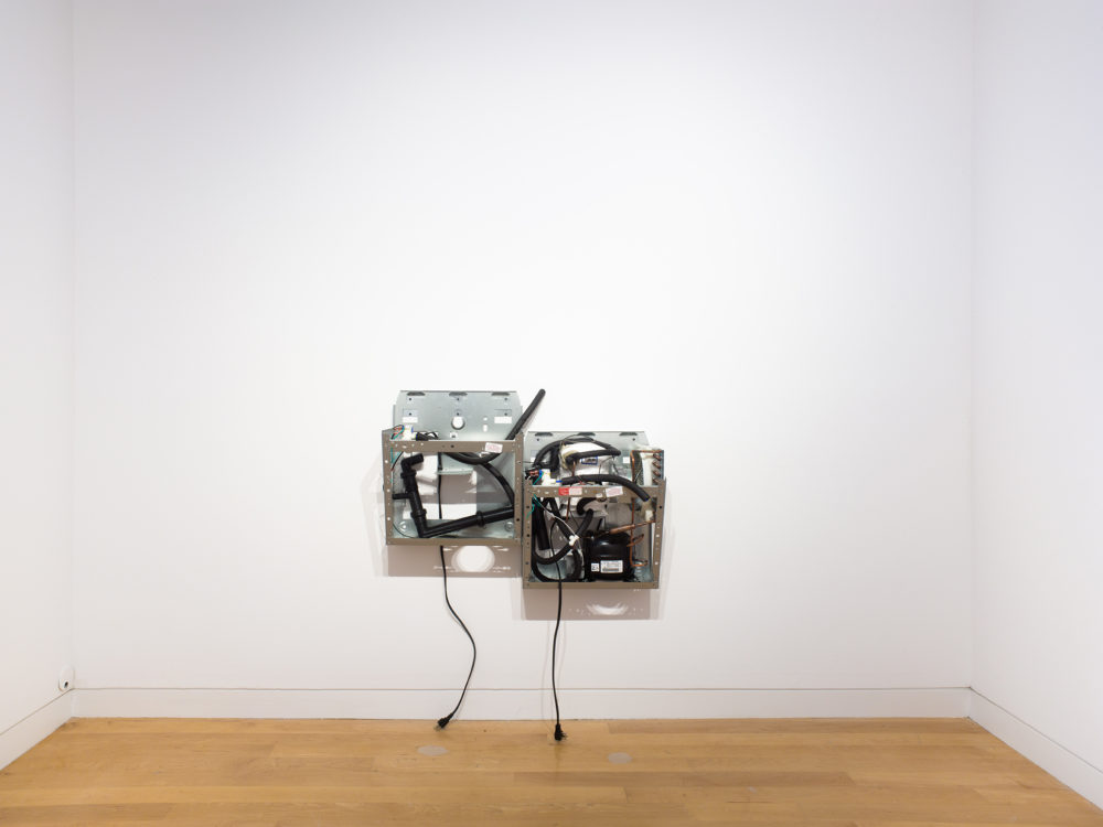 Sculpture of the interior of a water fountain against white wall