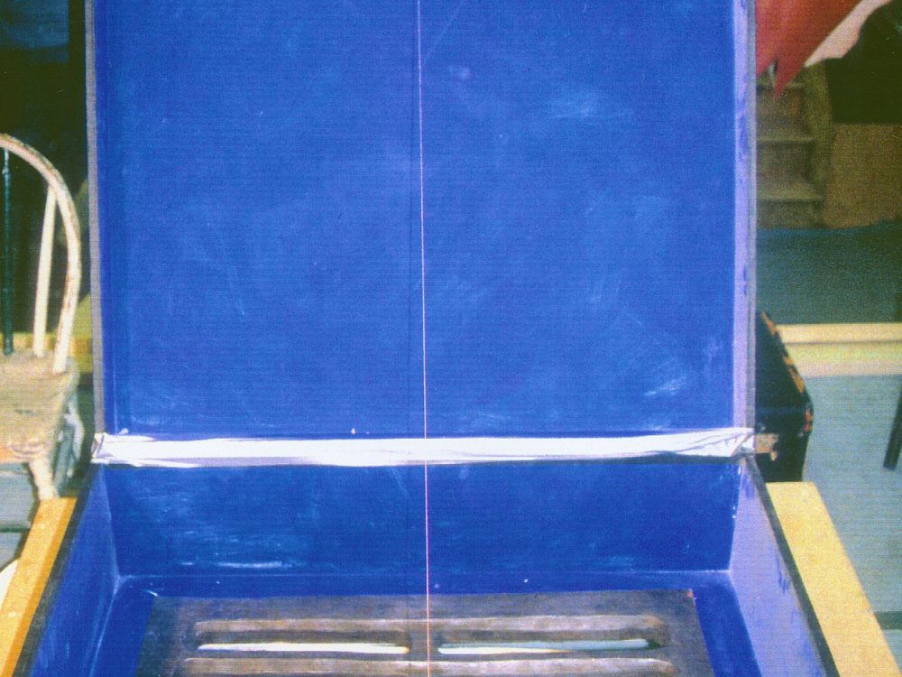 The creation of Robert Gober's suitcase with a drain on the bottom