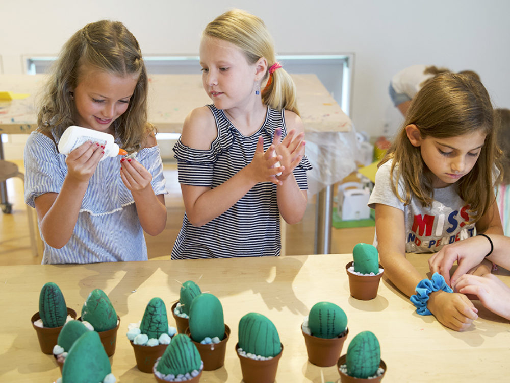 Two young children work on an art project