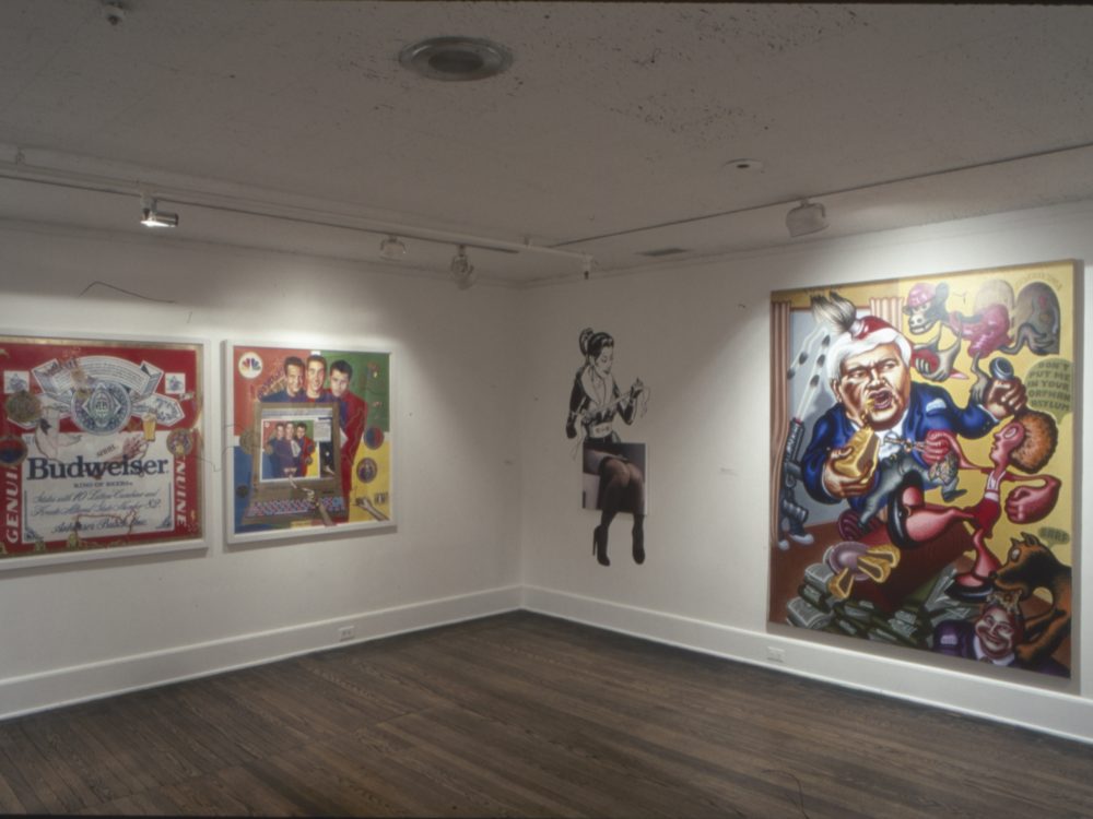 This is a photograph of the Pop Surrealism exhibition displaying many vibrant works of art