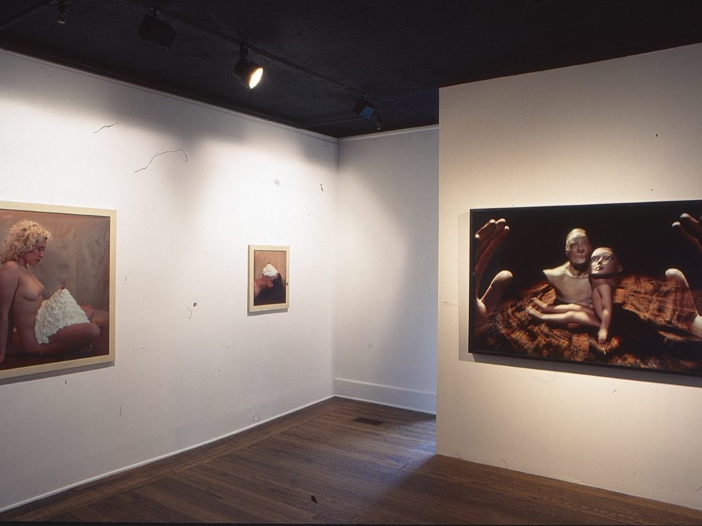 This is a photograph of the Pop Surrealism exhibition which displays many obscured and nude forms