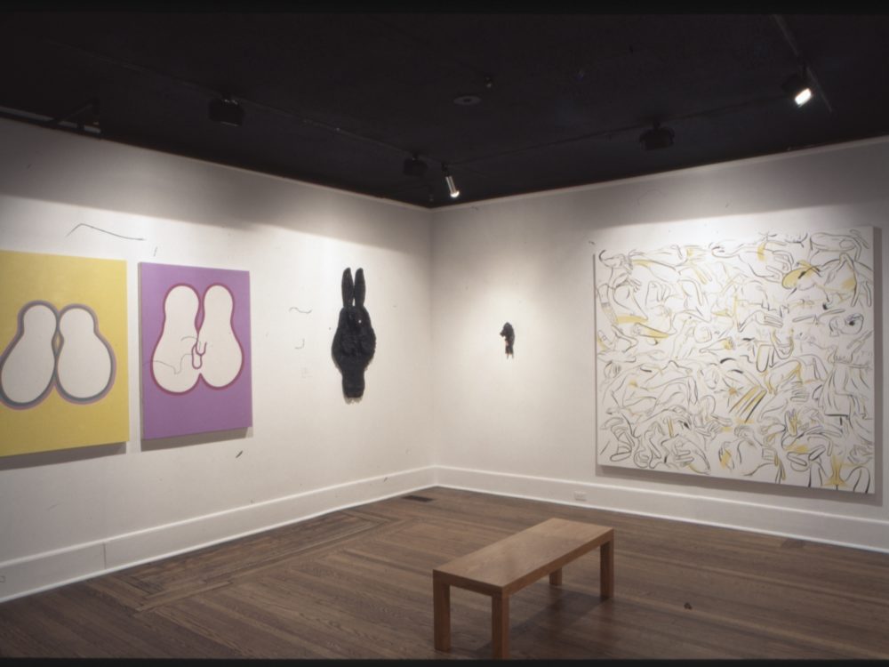 This is a photograph from the Pop Surrealism exhibition which features many vibrant and distorted displays of the body